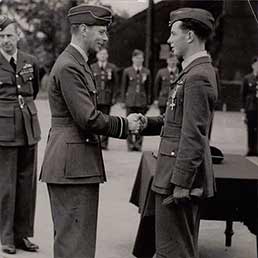 DFC awarded to P/O John Allen from King George VI.